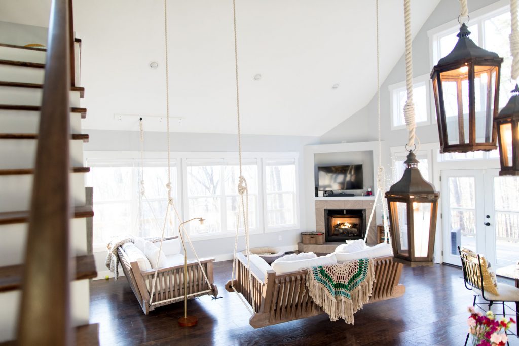 inside of Tennessee light house - living room with natural light, dark wood floors and hanging lanterns